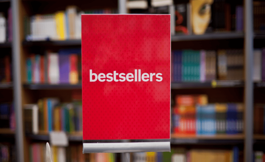 Red sign with white text that says bestsellers